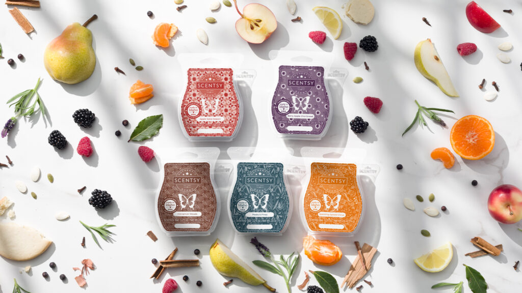 Scentsy wax bars from the fall harvest collection surrounded by fragrance notes of berries, spices, fruits, and fresh herbs