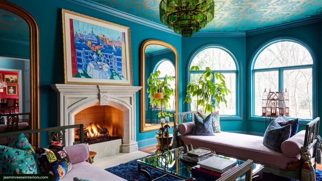 A livingroom decorated with bold blues and green colors and art deco styling.