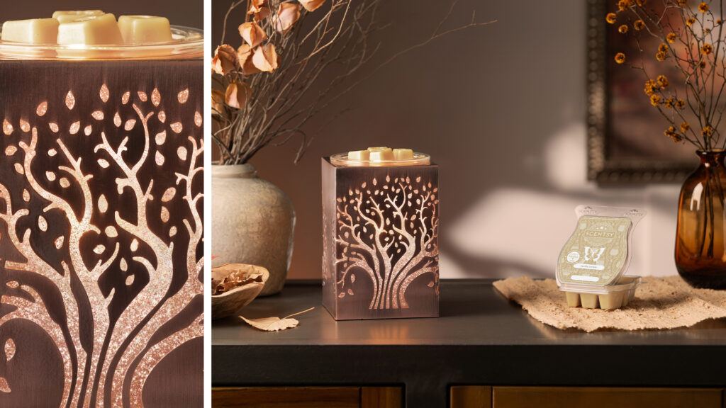 The Scentsy Deep Roots warmer positioned on a cabinet with a clamshell of Scentsy wax, with deep brown and beige tones that create a neutral aesthetic.