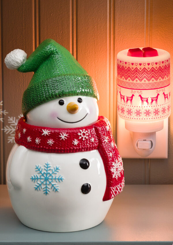 Scentsy warmers and mini warmers styled among warm Christmas decorations