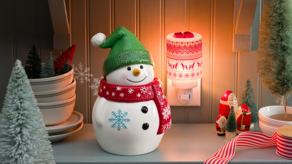 Scentsy warmers and mini warmers styled among warm Christmas decorations