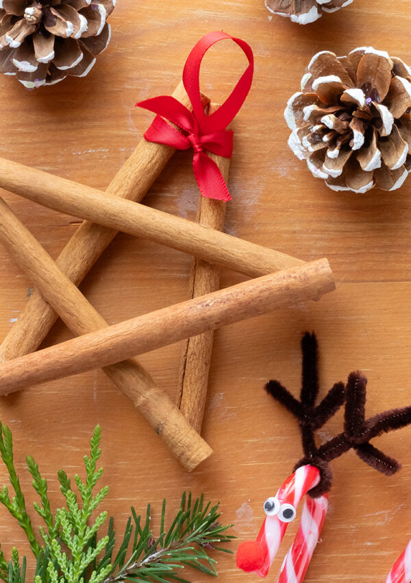 A scattering of DIY Christmas ornaments across a table.