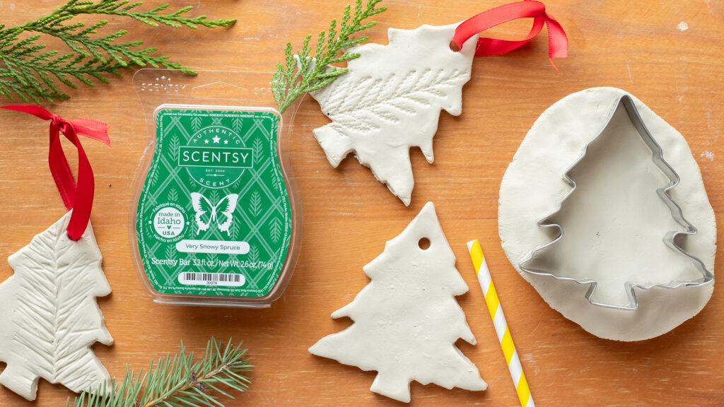 The Scentsy Very Snowy Spruce Wax Bar next to DIY clay Christmas tree ornaments.