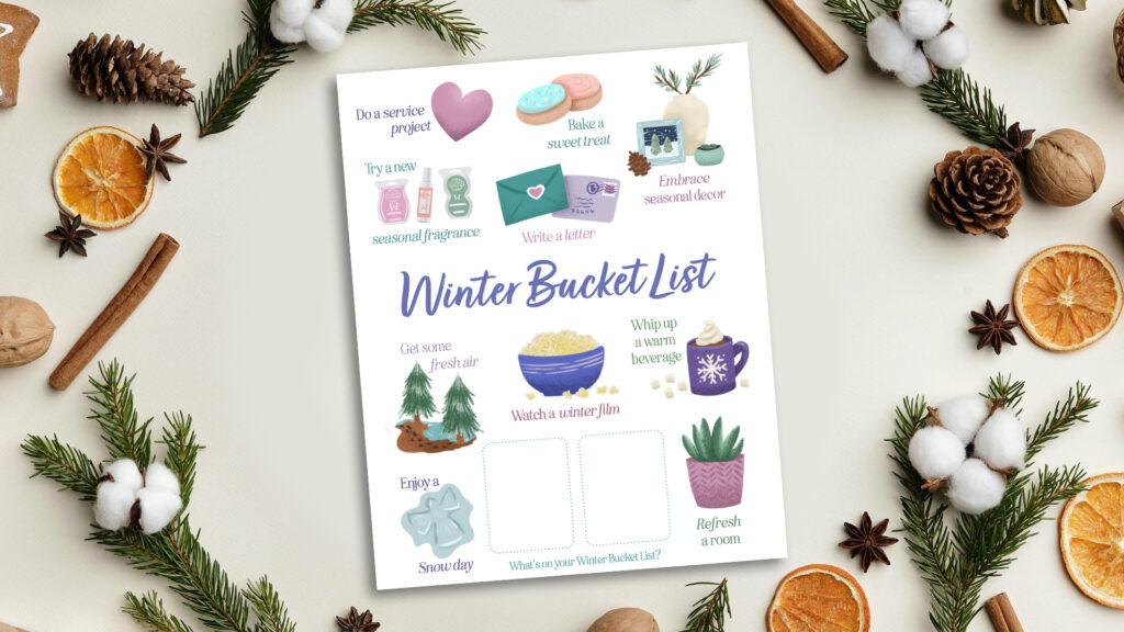 A printed winter bucket list on a table surrounded by Scentsy winter fragrance notes like pine branches, oranges, and cinnamon sticks.