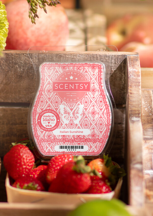 The Italian Sunshine Scentsy Wax Bar sitting among fruits in crates displayed in a farmer's market style.