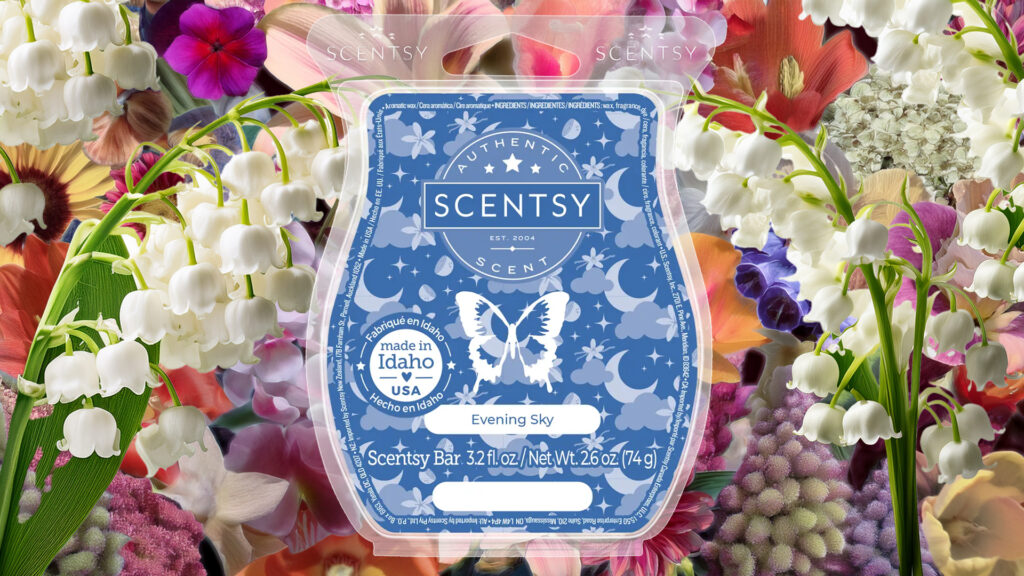 The Evening Sky Scentsy Wax Bar pictured in front of an array of beautiful white, purple, pink, and light orange flower blossoms.
