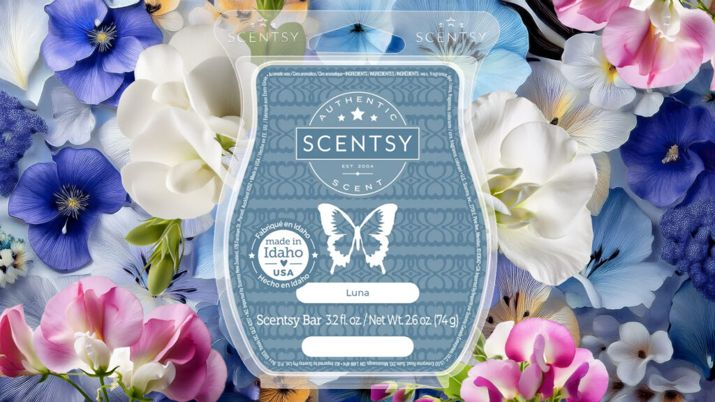 Scentsy's Luna Wax Bar pictured in front of an array of white, light blue, dark blue, and pink flowers.