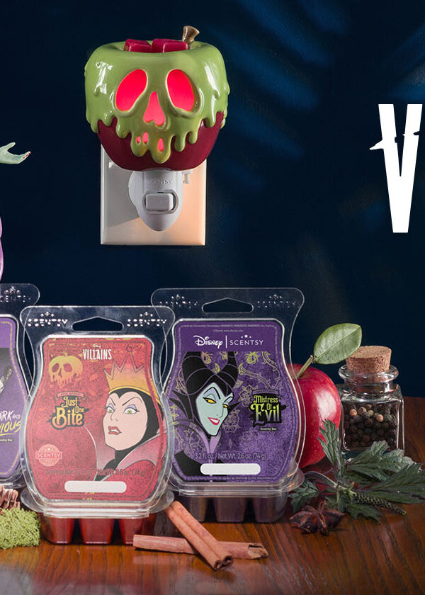 Scentsy Wax Bars Disney Maleficent: Mistress of Evil, Disney Evil Queen: just one bite, and Disney Villains: Dark and Devious, sti on a table with the Maleficent: Made for Mayhem Warmer and Just One Bite Mini-Warmer shaped like the old witch's poisoned apple from Snow White.