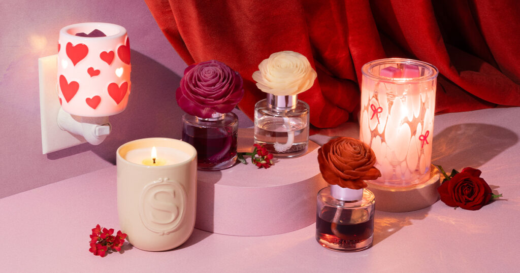 The Scentsy Valentine's Day collection of warmers, mini-warmers, fragrance flowers, and canldes styled with rose blossoms and red velvet curtains.