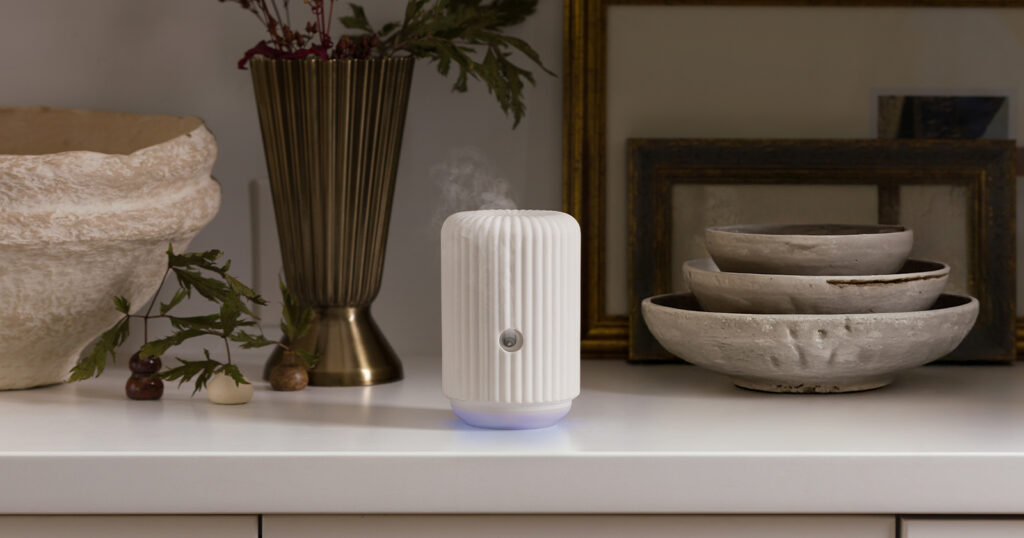 The Scentsy Solo diffuses fragrance on a home kitchen counter.