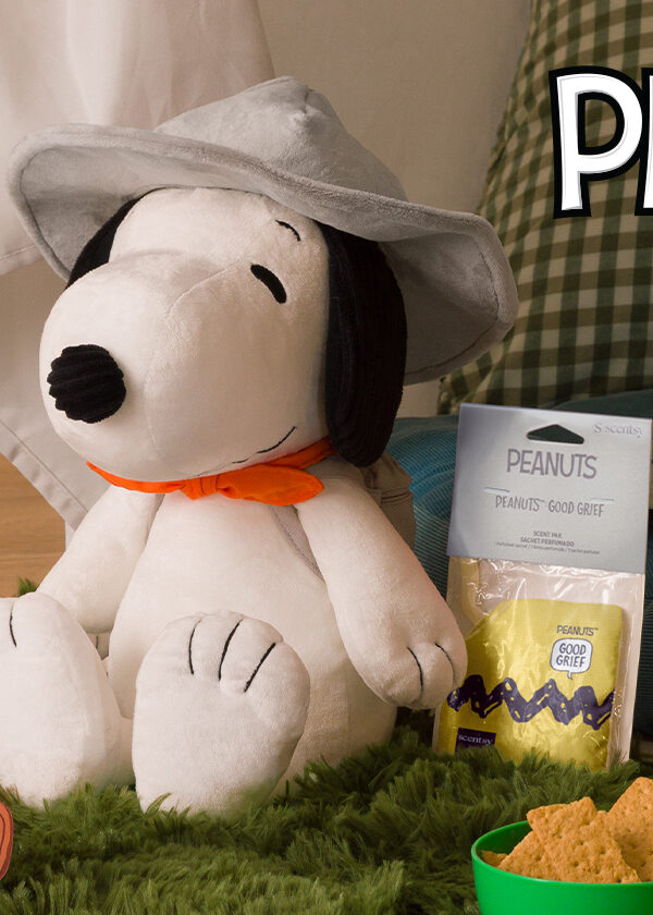 A Snoopy™ Beagle Scouts – Scentsy Buddy is ready for indoor camping with a fake fire and scout hat.