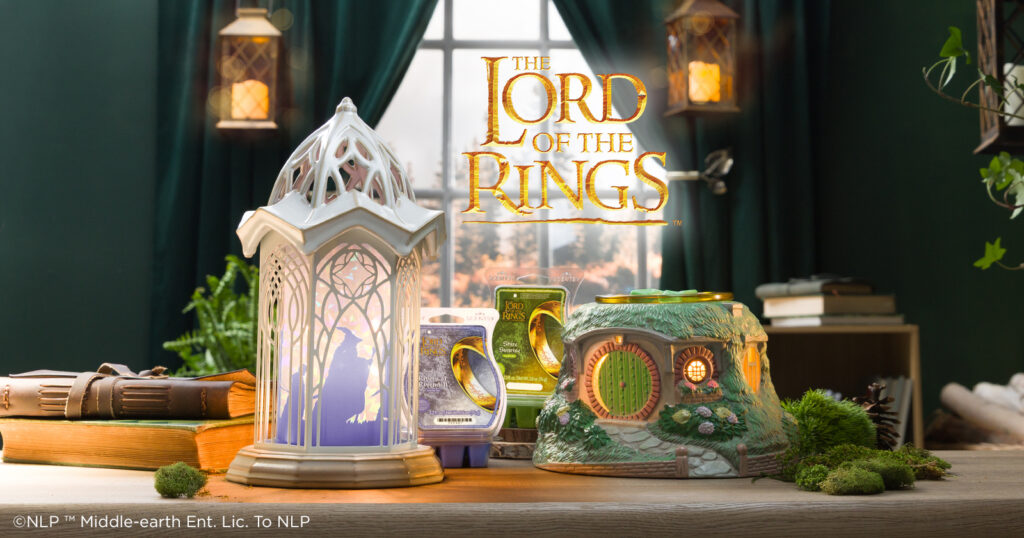A The Lord of the Rings: Rivendell – Scentsy Warmer and The Lord of the Rings: Bag End - Scentsy Warmer are displayed in a room styled to look like an elven haven with two exclusive wax melt fragrances.