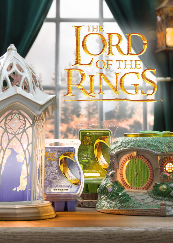 A The Lord of the Rings: Rivendell – Scentsy Warmer and The Lord of the Rings: Bag End - Scentsy Warmer are displayed in a room styled to look like an elven haven with two exclusive wax melt fragrances.